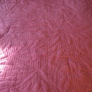 Quilted red bedspread